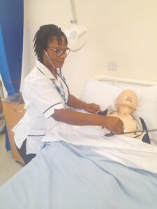 Photograph of apprentice Suzie using the simulation suite equipment.